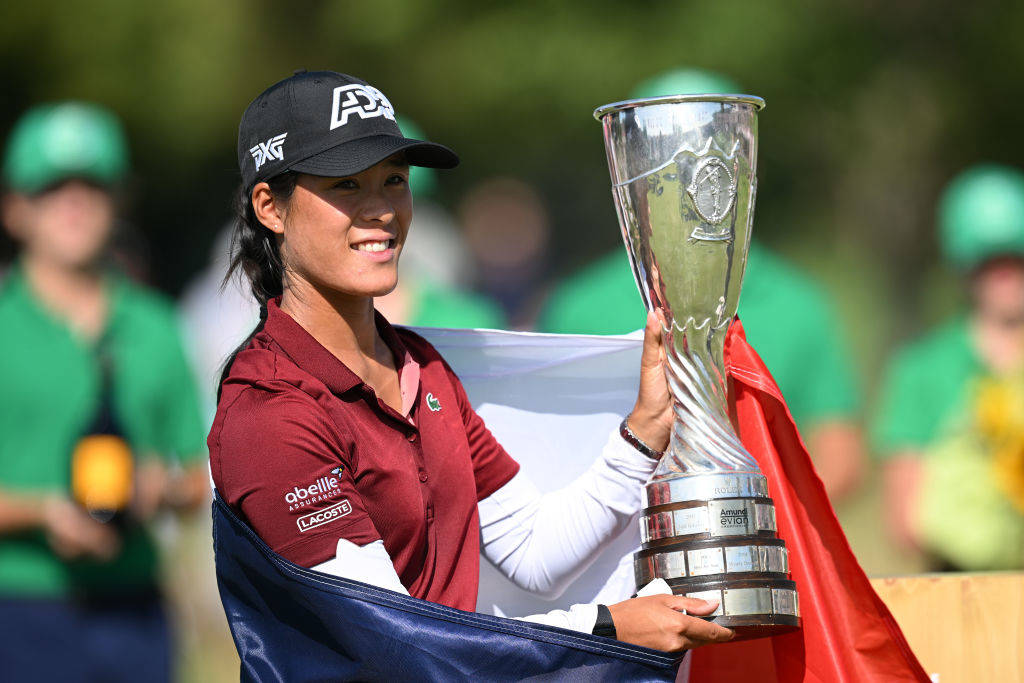 Celine Boutier poses with the Evian Championship trophy.